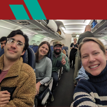 Some members of NEFE staff sitting on a plane